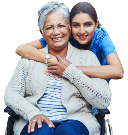 female caregiver hugging elderly woman and both smiling